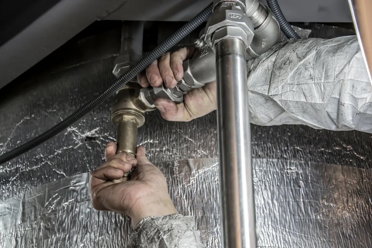Plumber fitting residential pipework